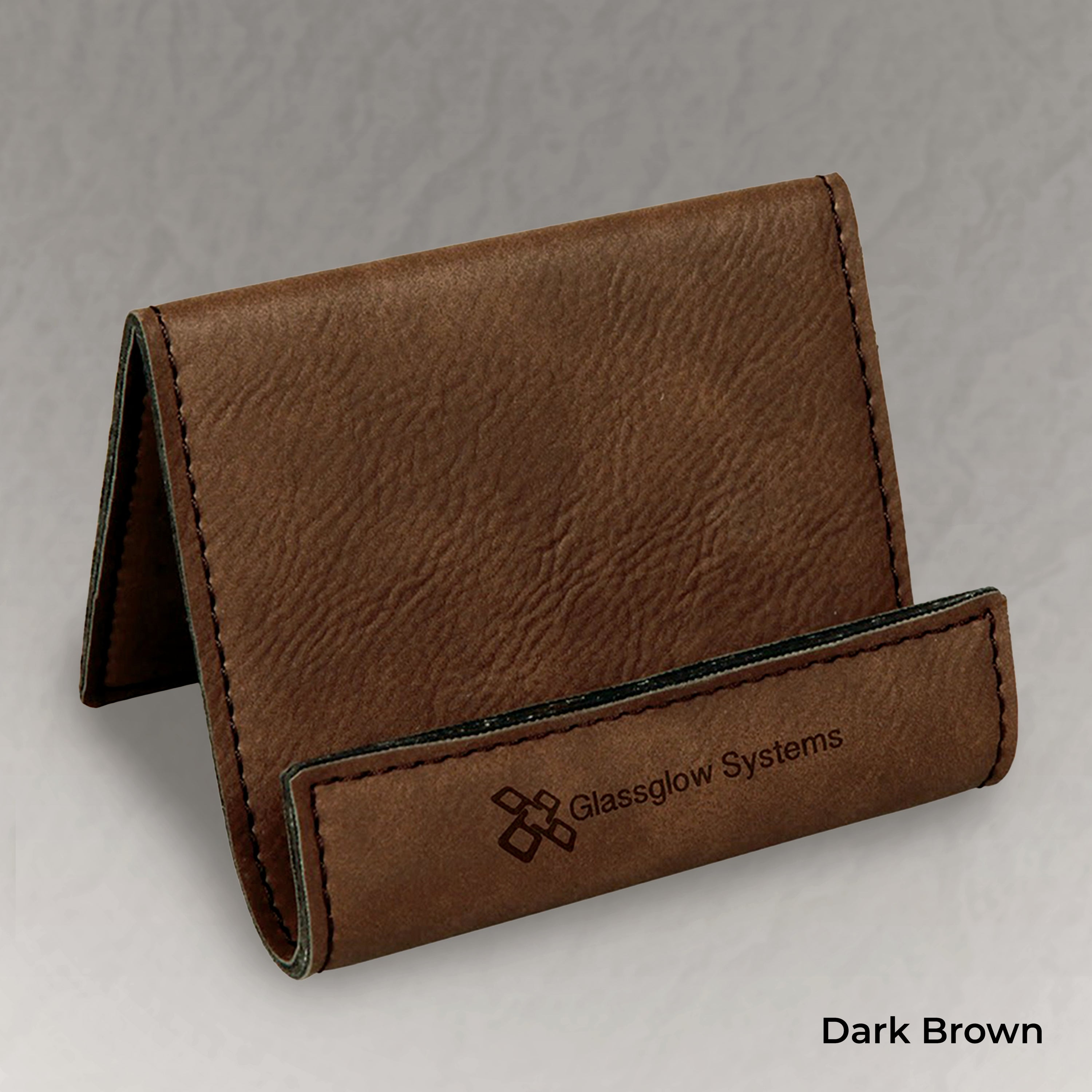 Dark brown leather business card holder with Glassglow Systems logo on a gray background