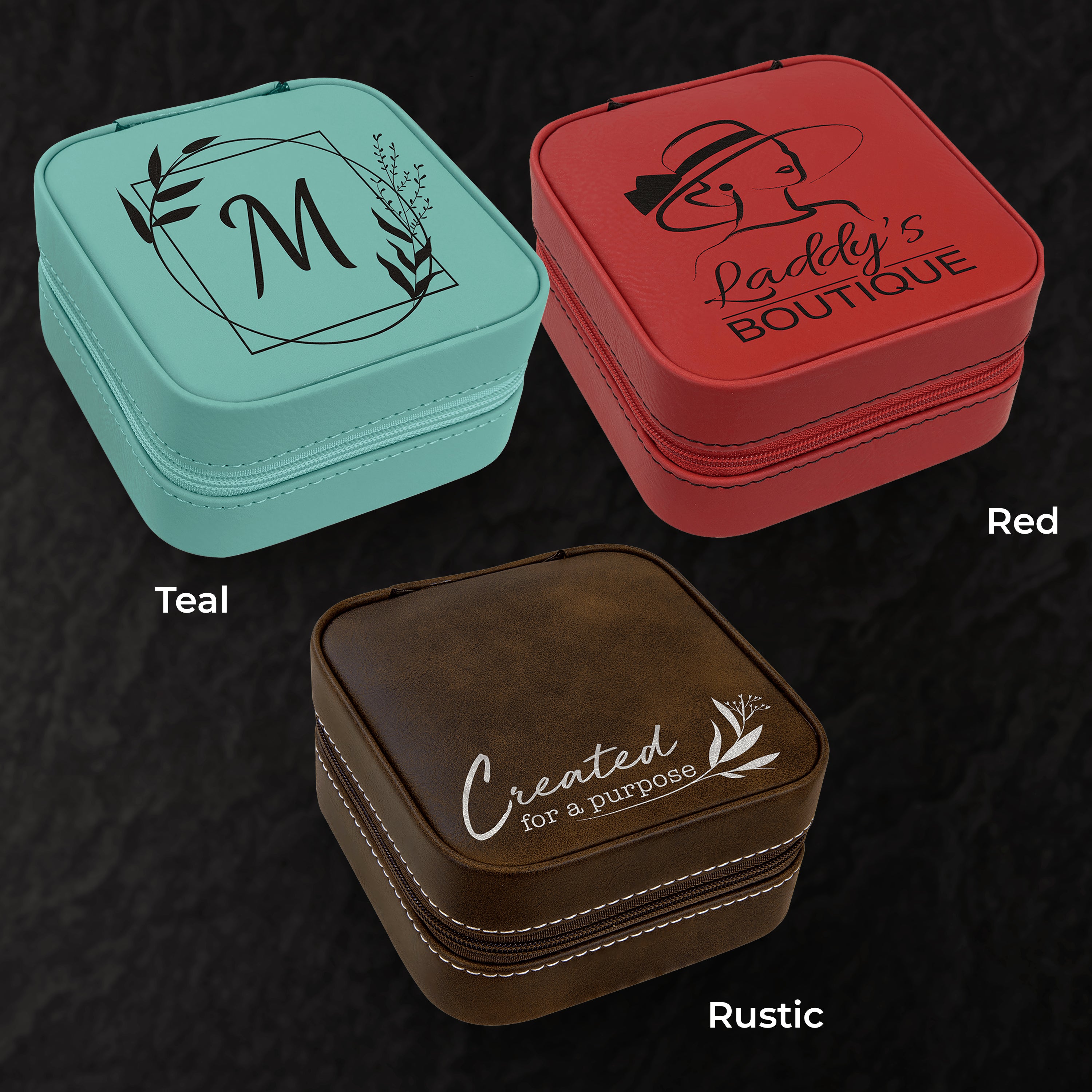 Three jewelry boxes in teal, red, and rustic brown on a dark textured background.