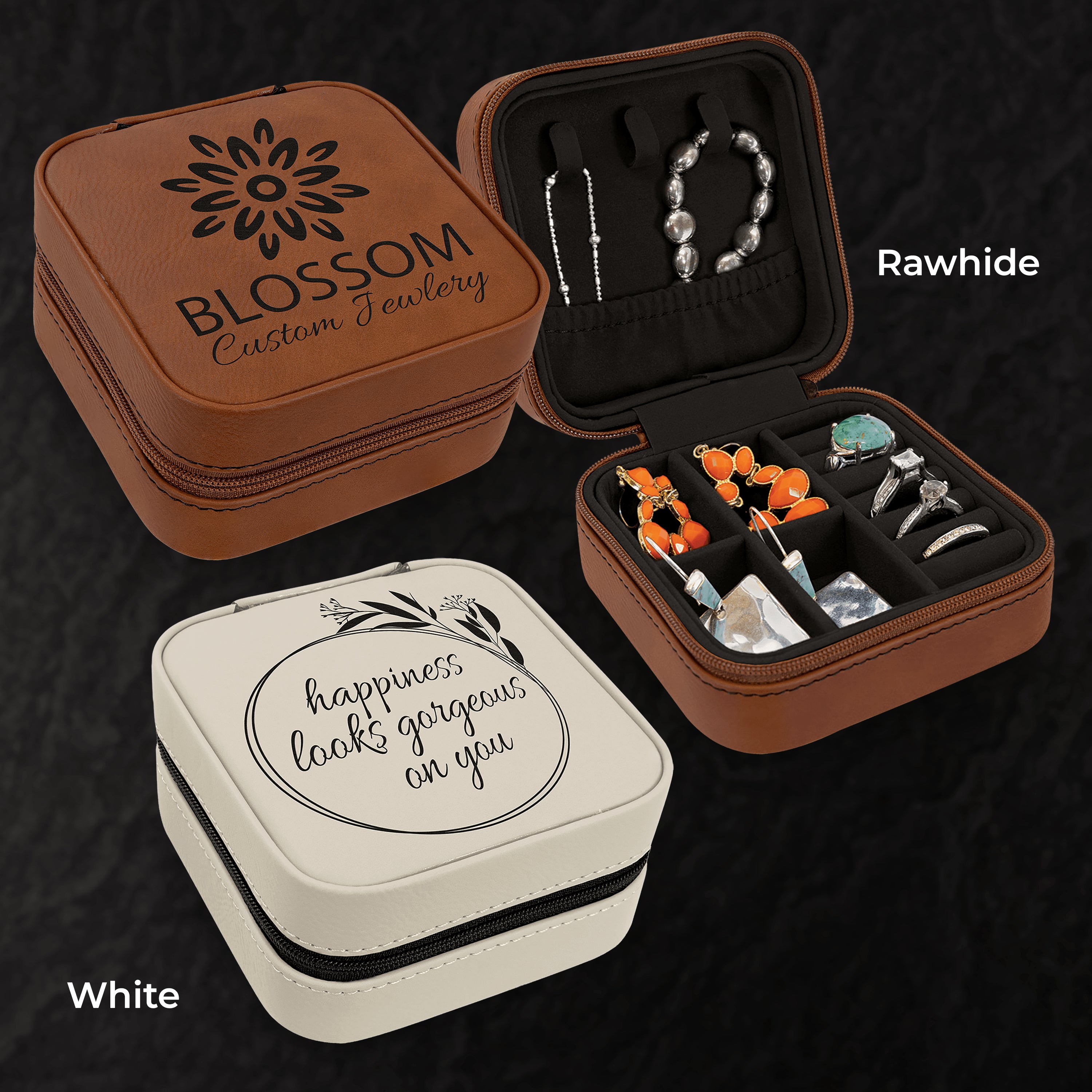 Two jewelry cases, one brown and one white, with jewelry inside on a dark background.