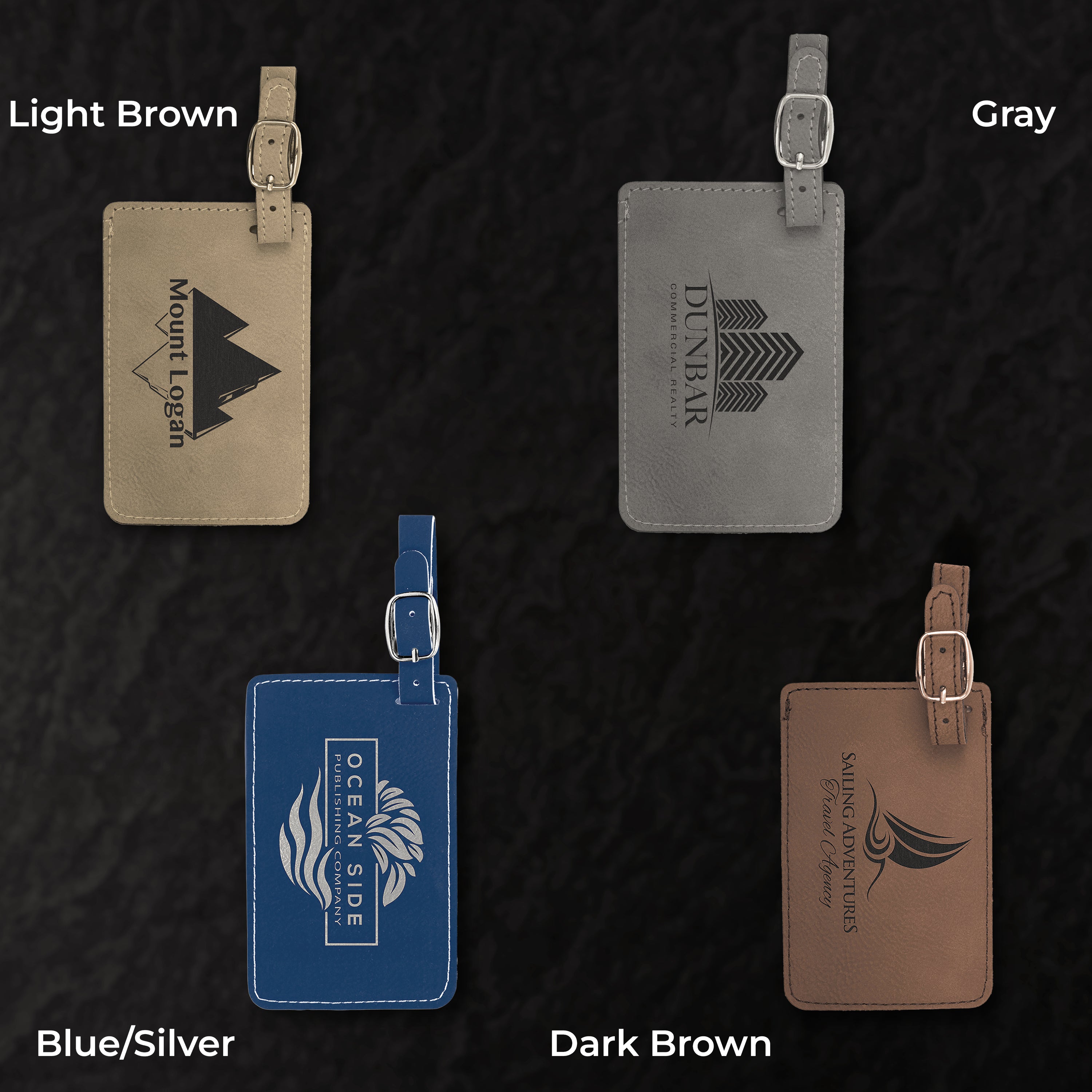 Four leather luggage tags in different colors on a textured black background
