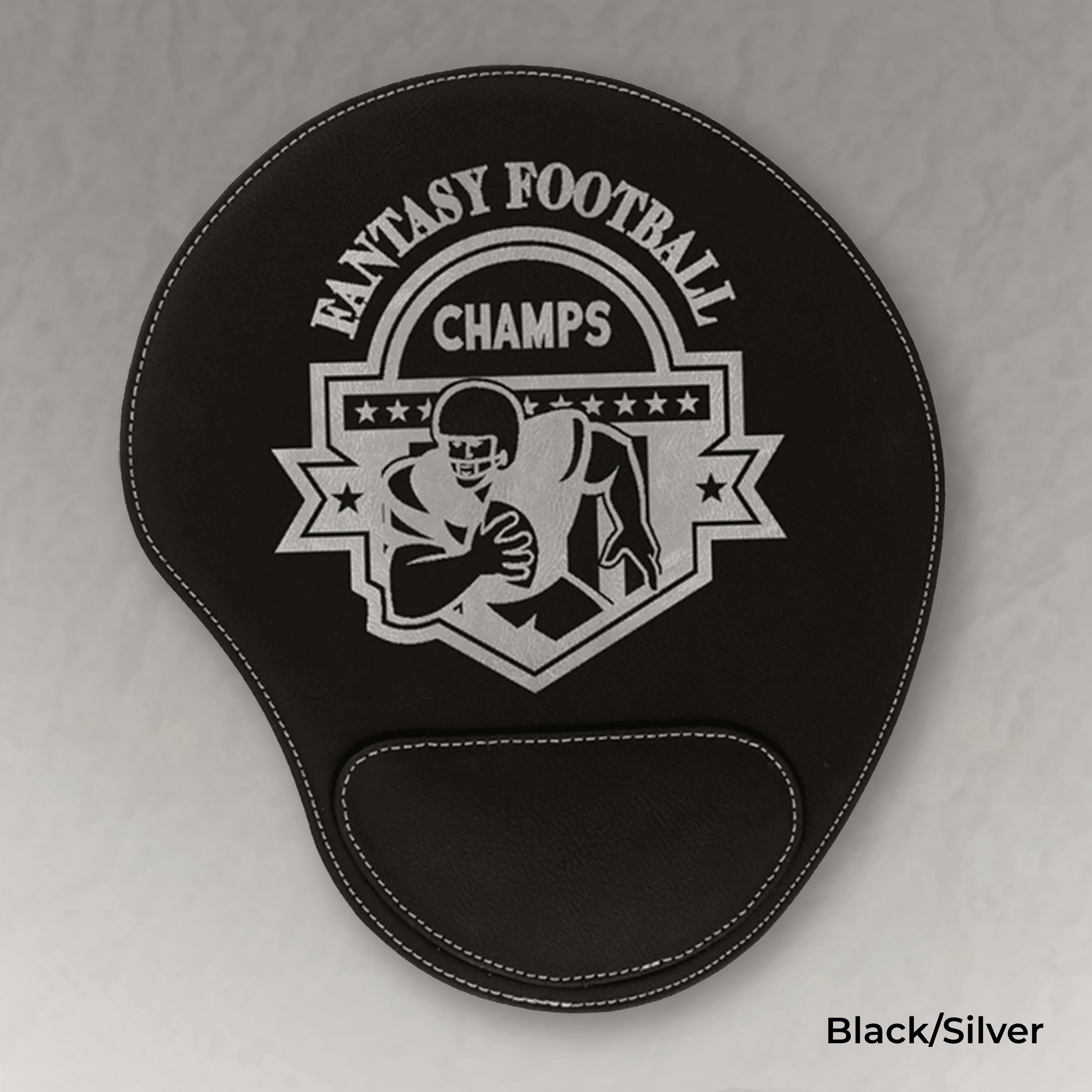 Black mouse pad with 'Fantasy Football Champs' design on a gray background