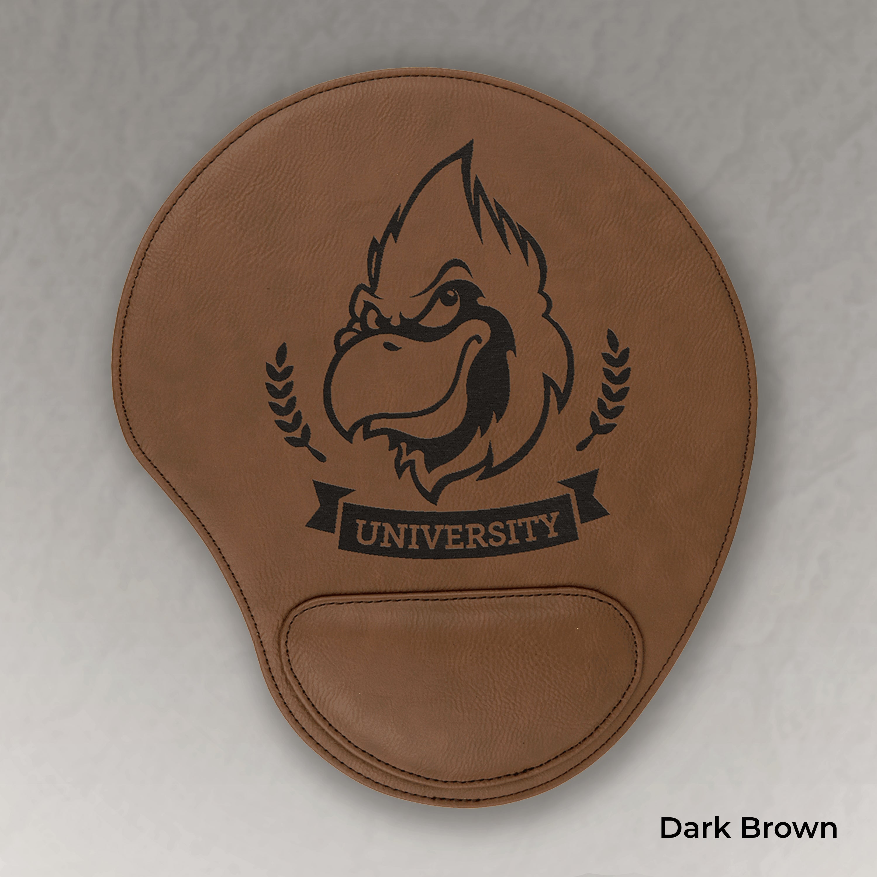 Brown mouse pad with a logo and 'University' text on a gray background