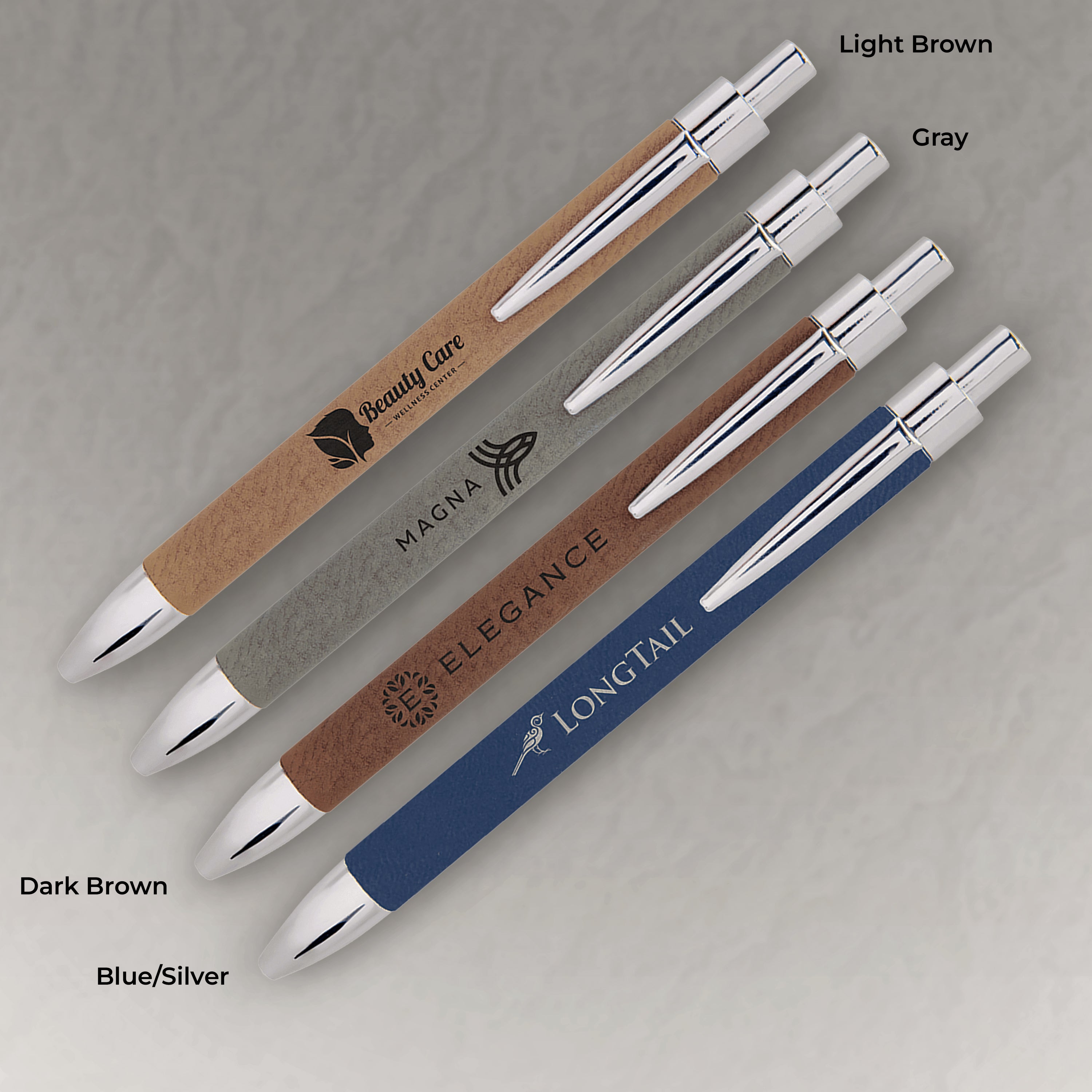 Set of pens with different colored bodies and silver accents on a gray background