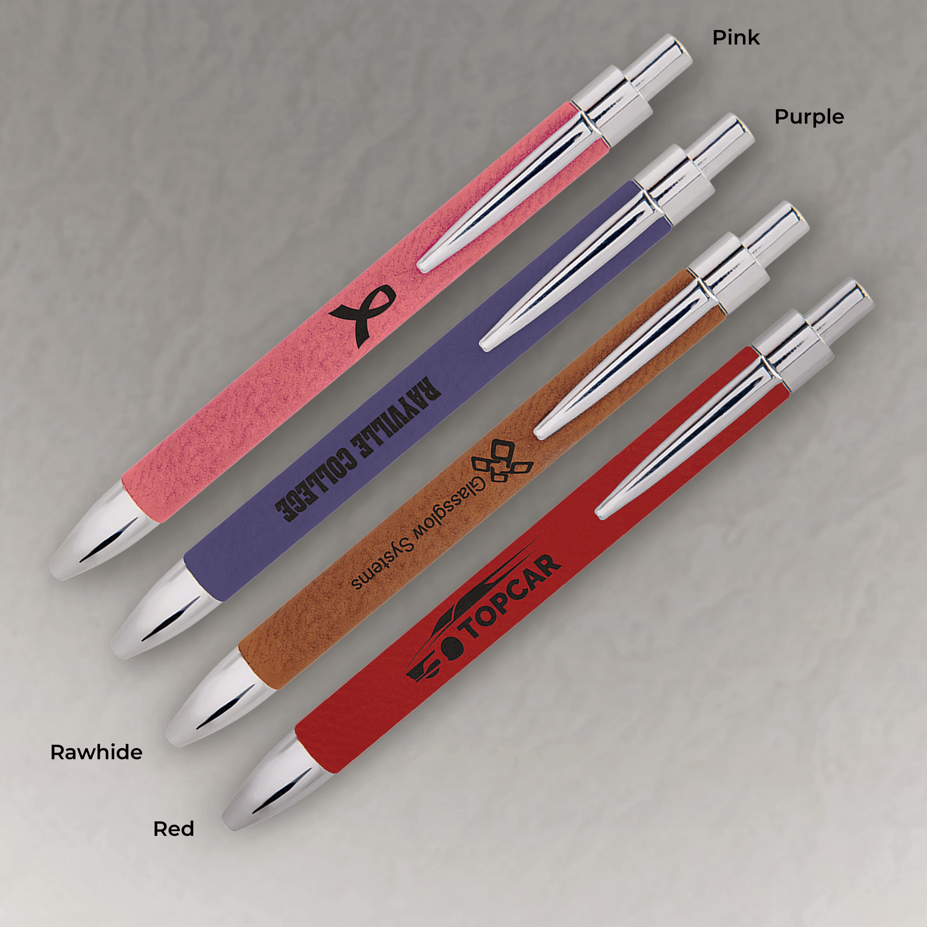 Four pens with different colored bodies and tops on a gray background