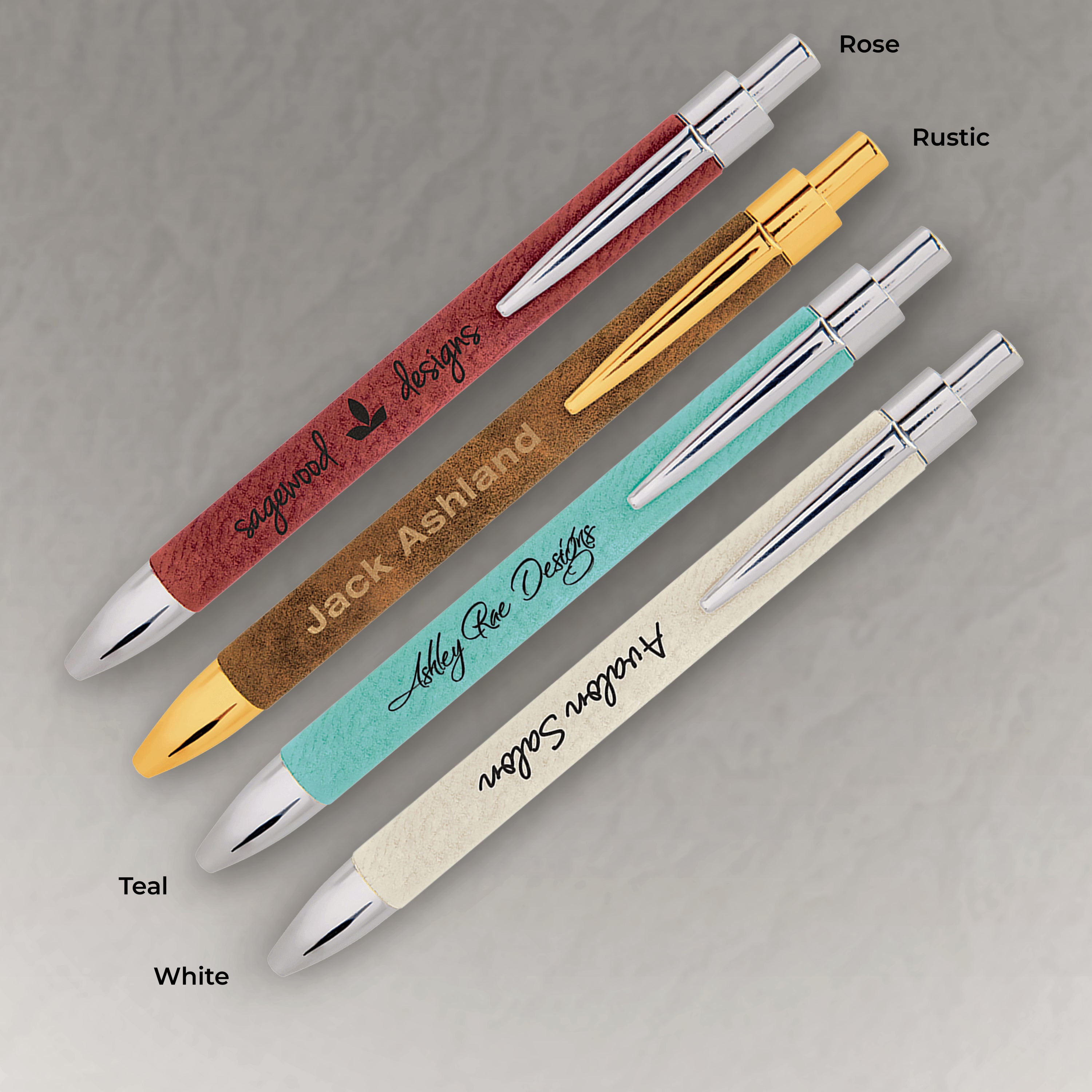 Set of pens with different finishes and colors on a gray background