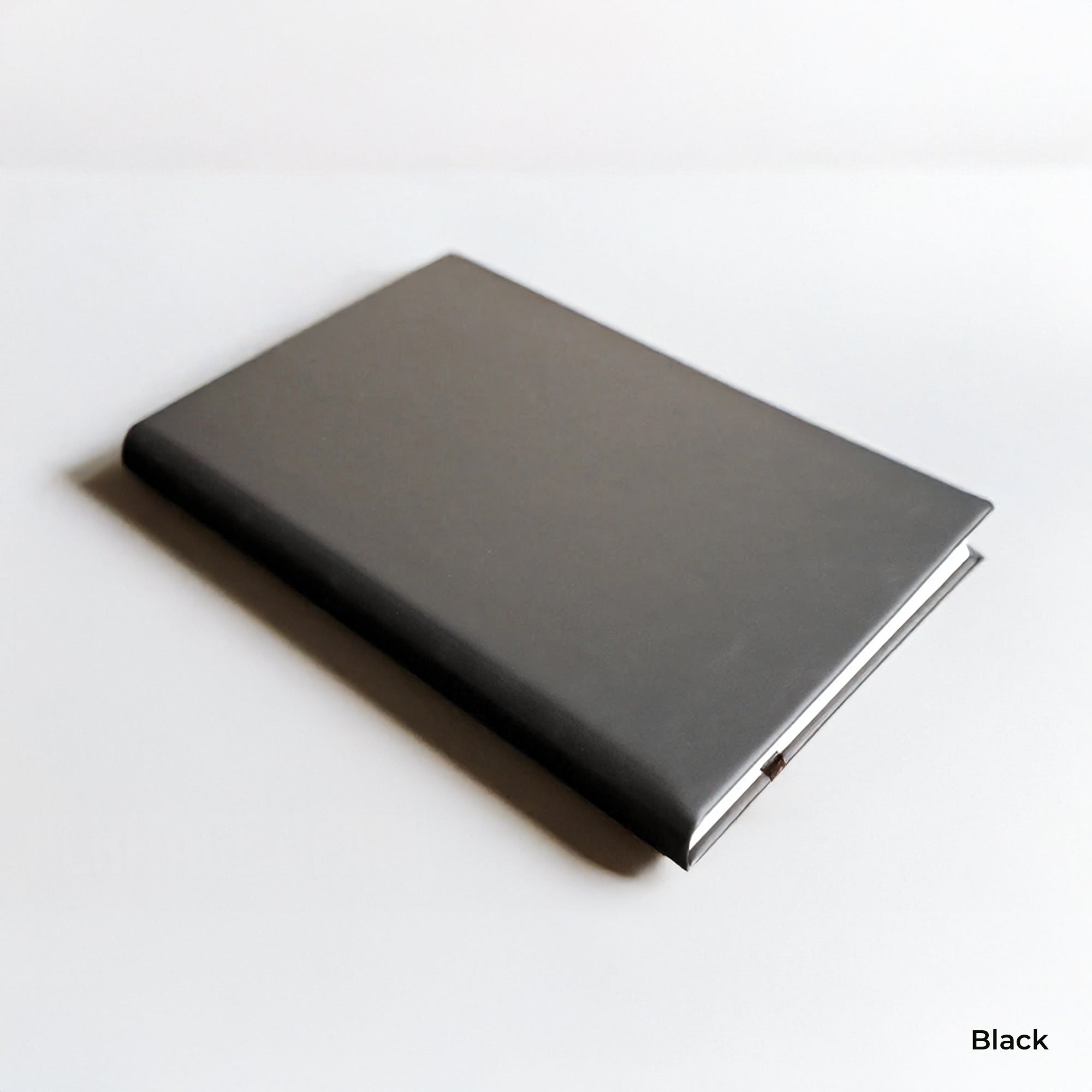 Black notebook on a white background