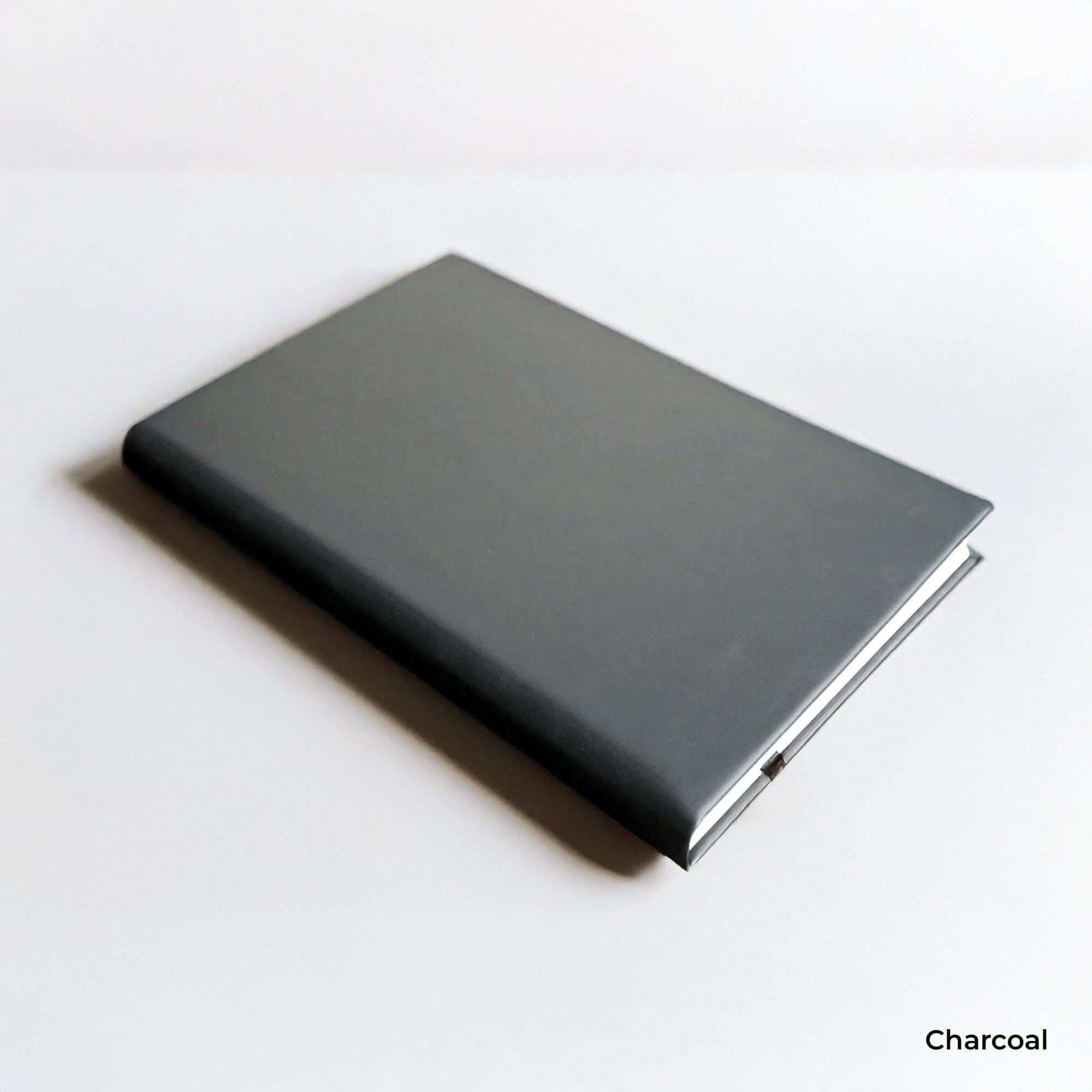 Charcoal-colored notebook on a white background