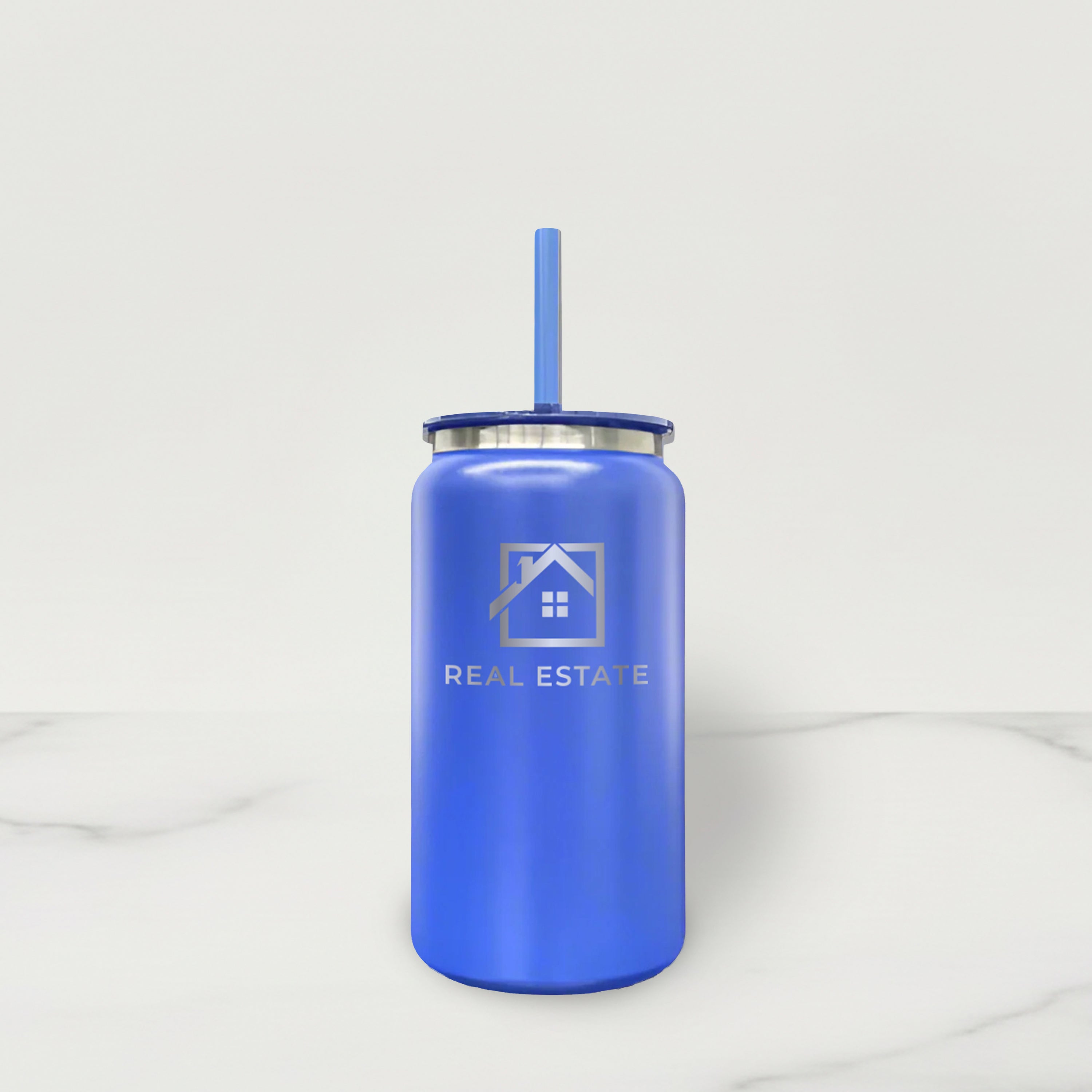 Blue tumbler with a straw on a white background