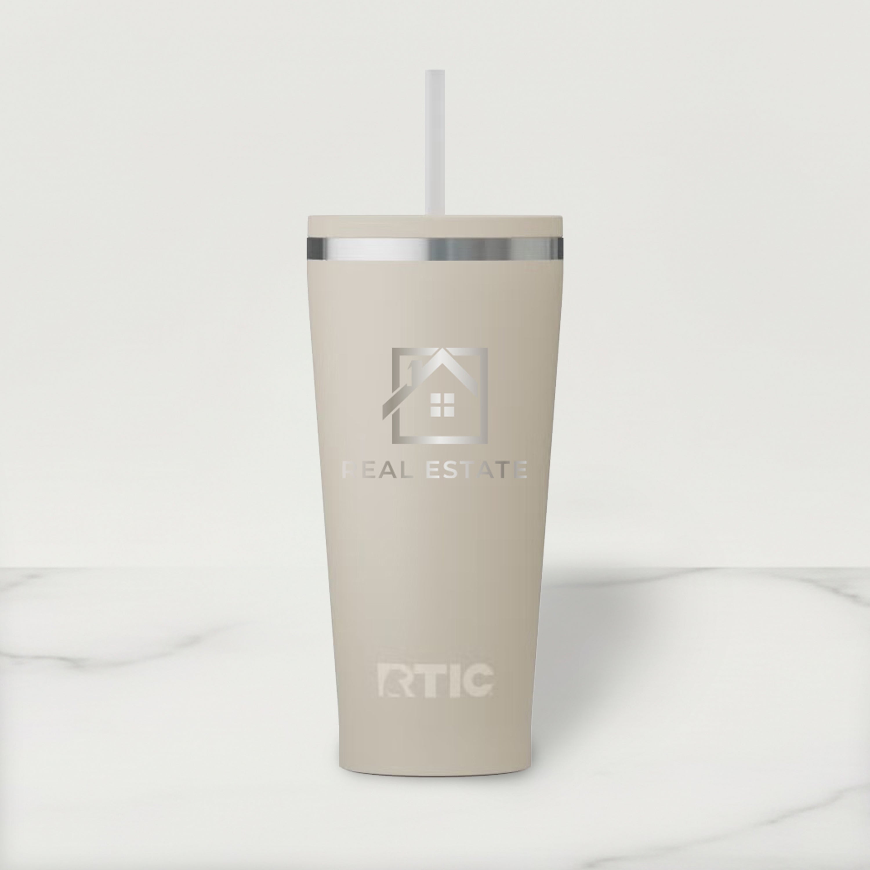 Beige RTIC tumbler with a logo on a white background