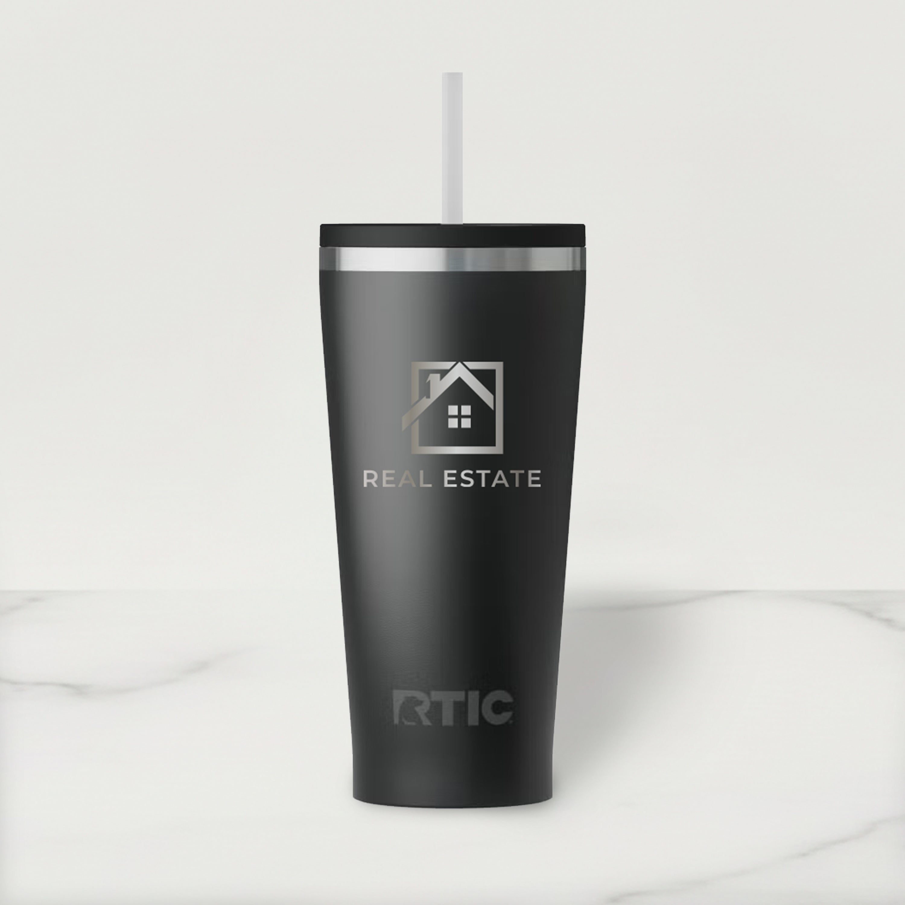 Black RTIC tumbler with real estate logo on a white background