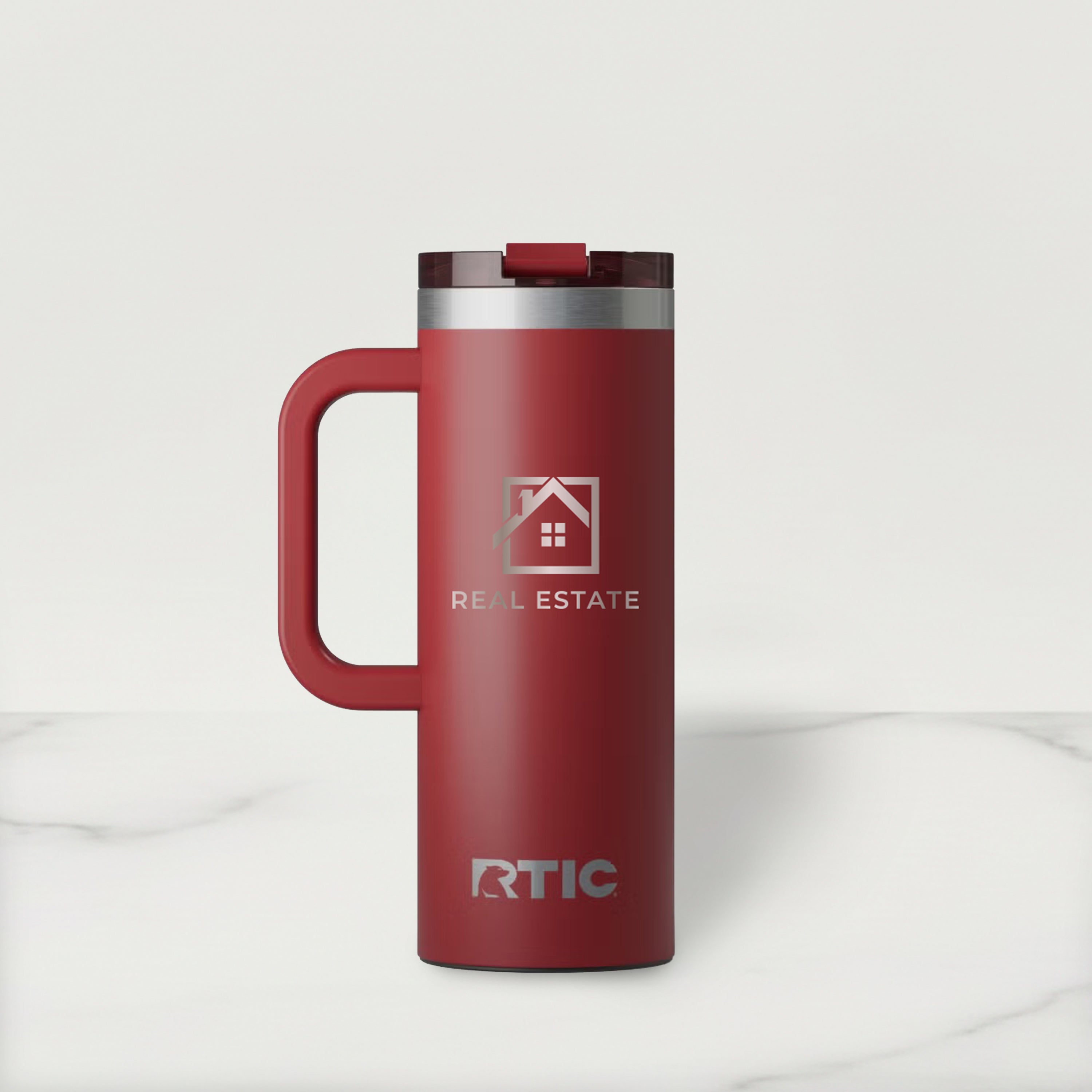 Red RTIC travel mug with a handle on a white background