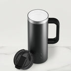 Black insulated travel mug with a lid on a white background