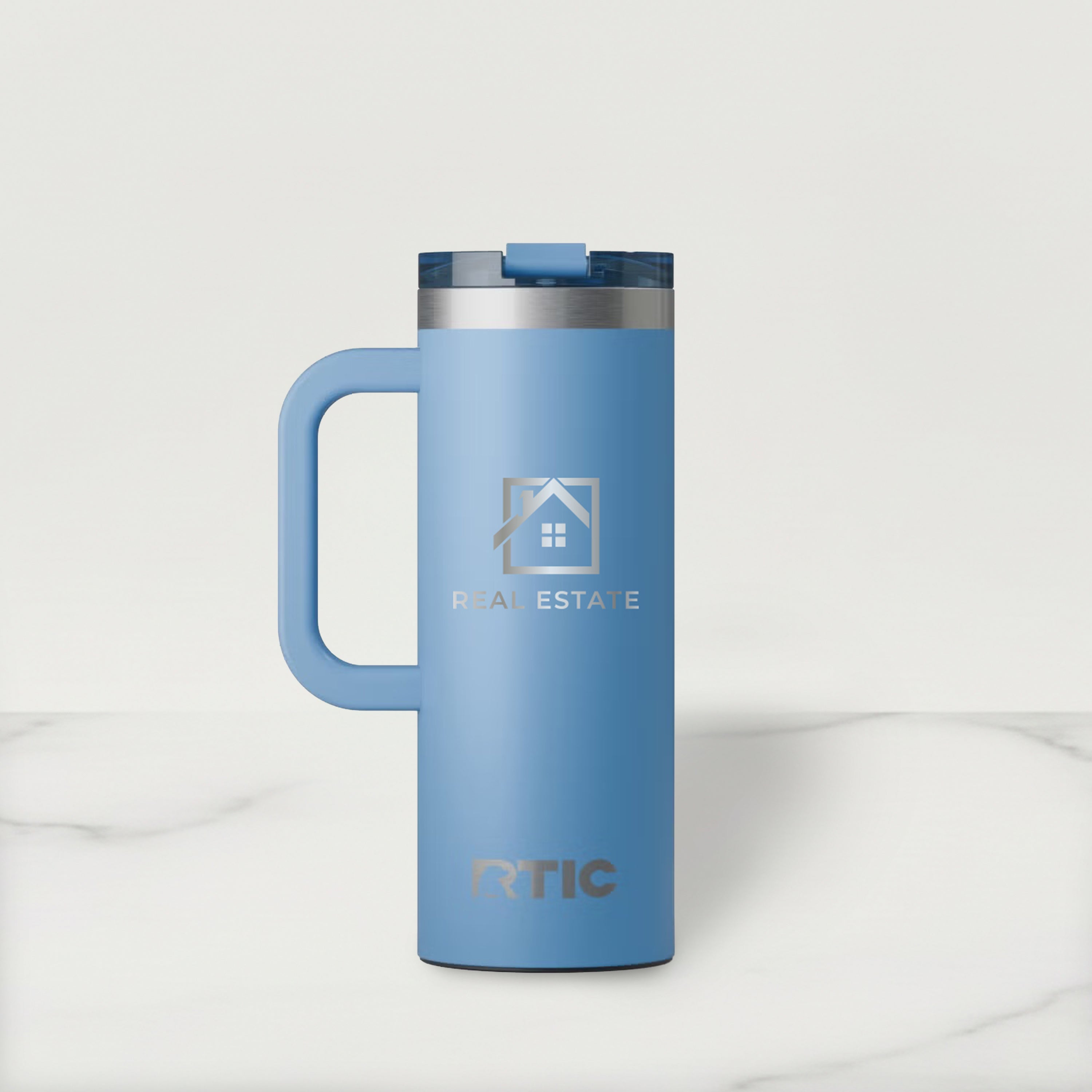 Blue RTIC mug with Real Estate logo on a white background