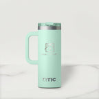 Mint green RTIC mug with handle on a light gray background