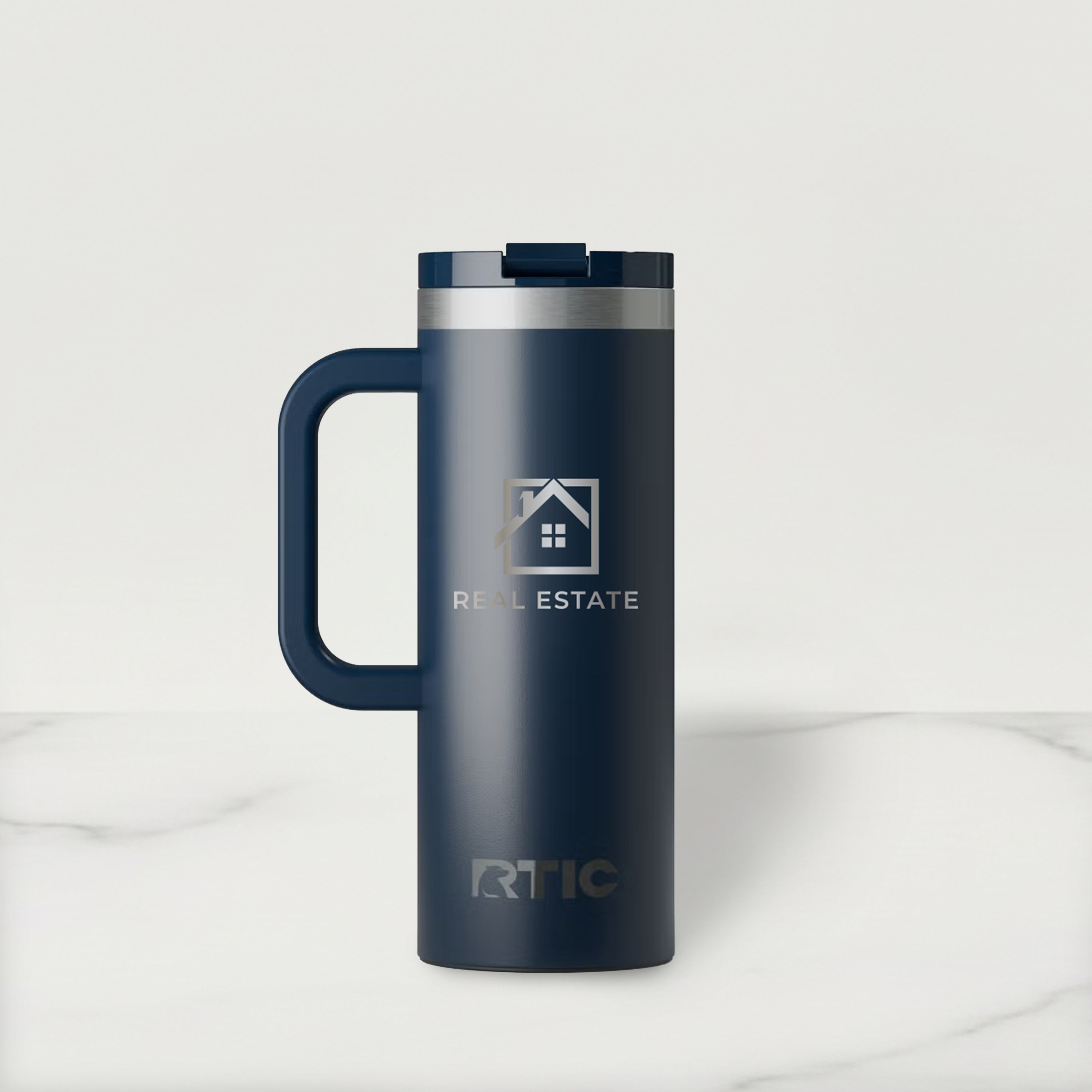 Navy RTIC travel mug with a real estate logo on a white background