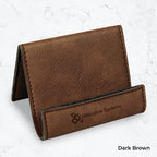 Brown business card holder with black engraving on a marble background