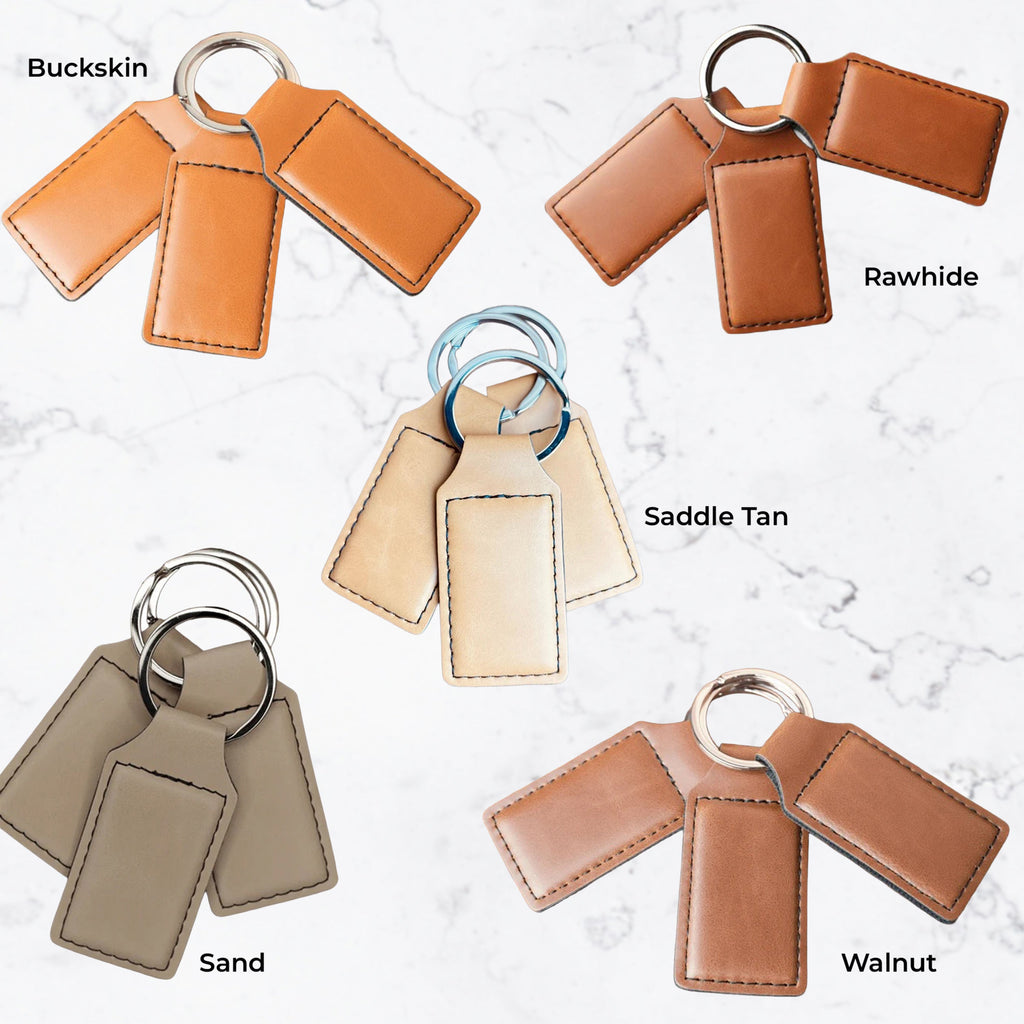 Set of leather keychains in different colors on a light background