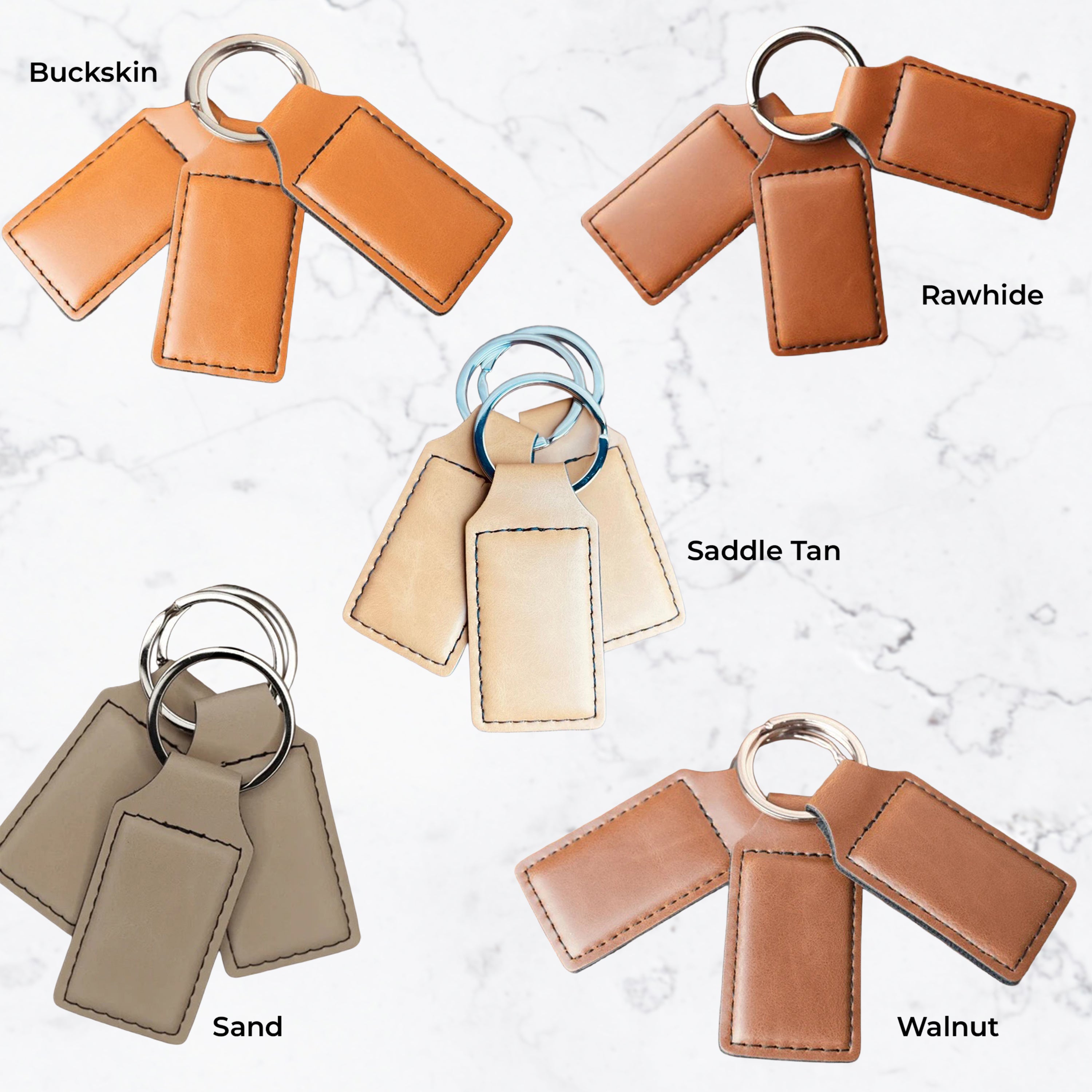 Set of leather keychains in different colors on a light background