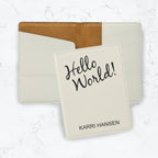 White passport cover with black engraving on white marble background