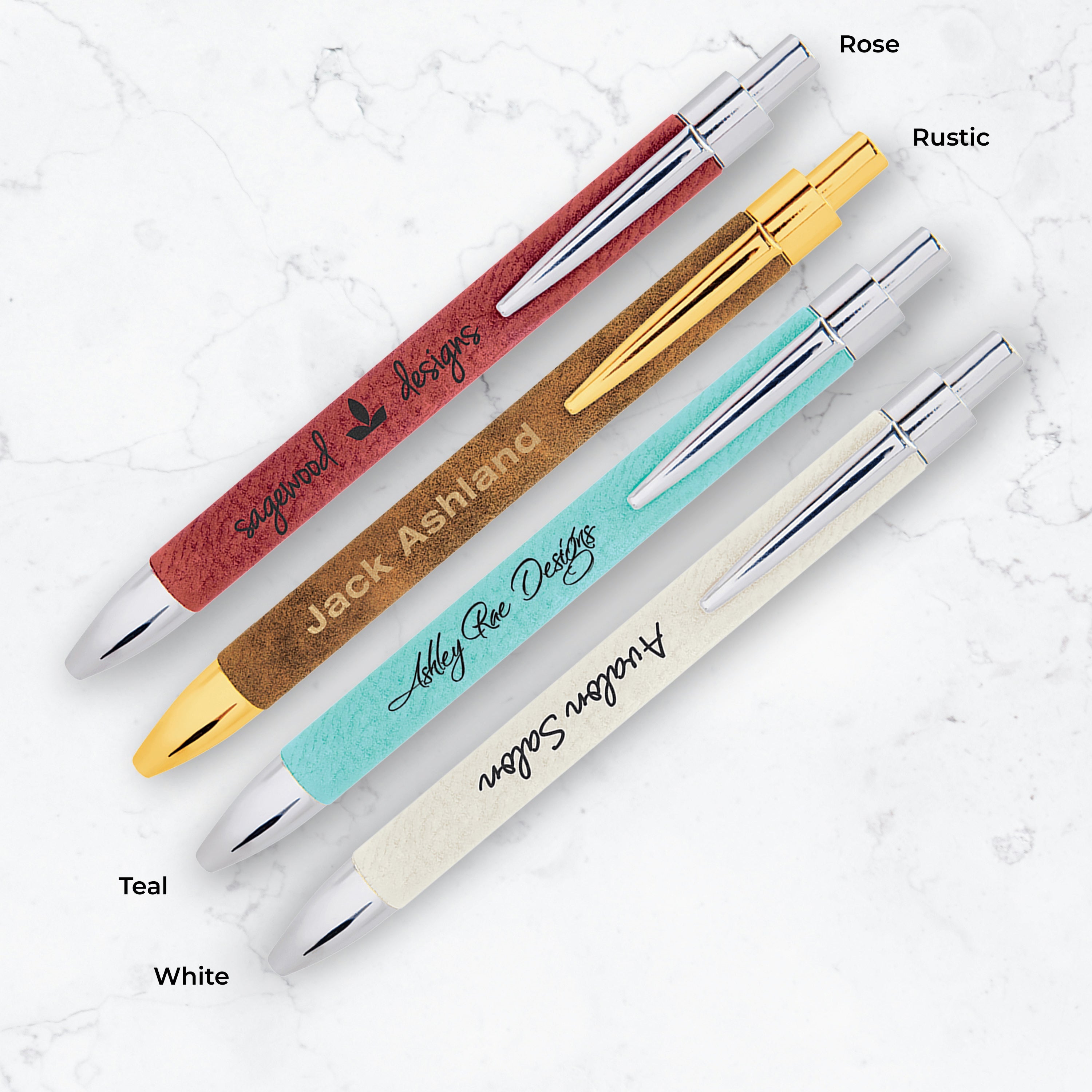 Set of pens with different color bodies and finishes on a textured white background