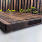 Wooden cutting board with a blurred outdoor background