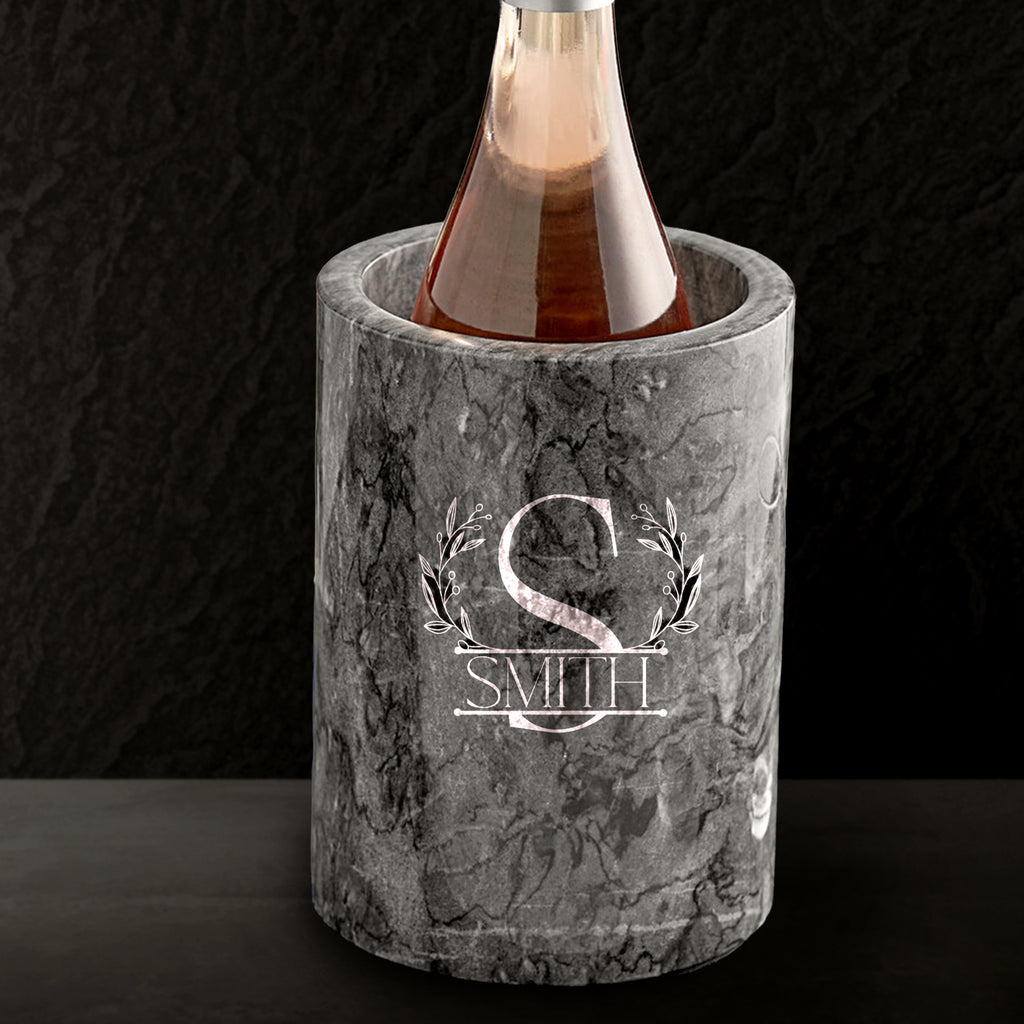 Marble wine cooler with engraved 'Smith' monogram on a dark background