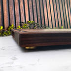 Wooden tray on a white surface with a wooden background