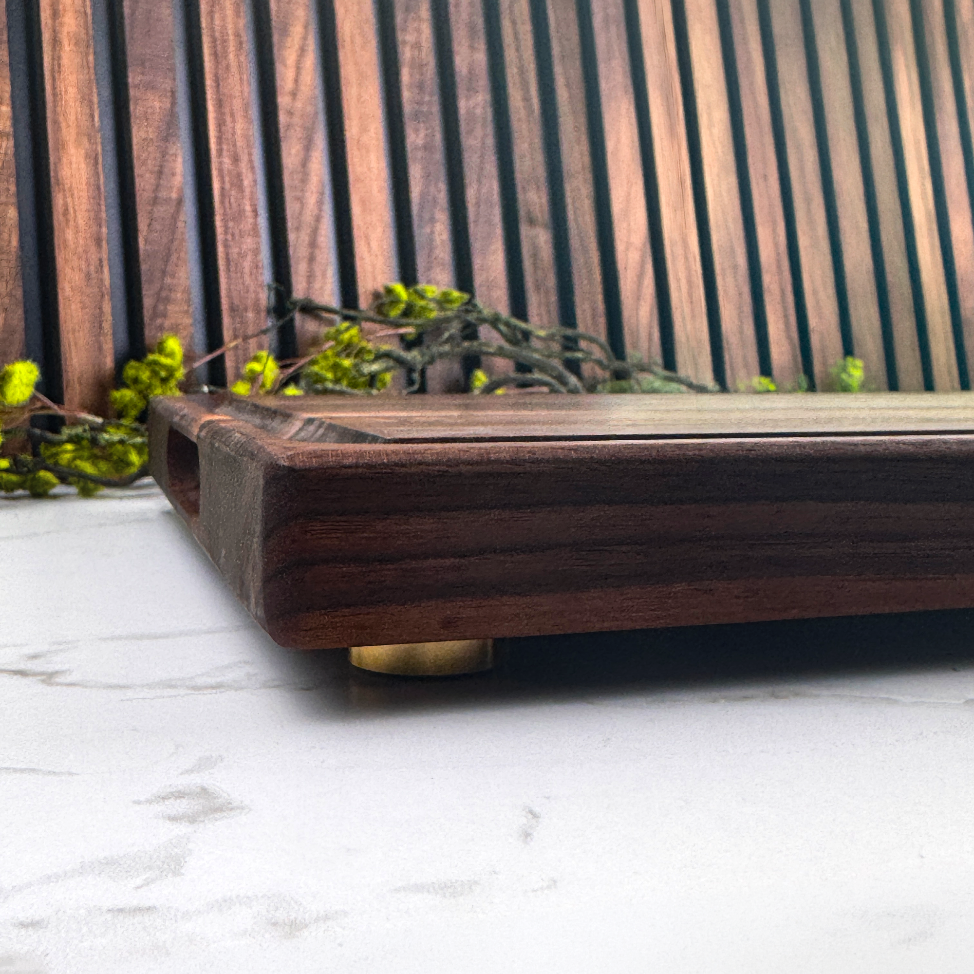 Wooden tray on a white surface with a wooden background